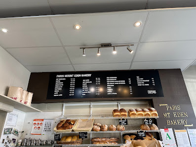 Interior counter and menu boards at Paris Mt Eden Bakery